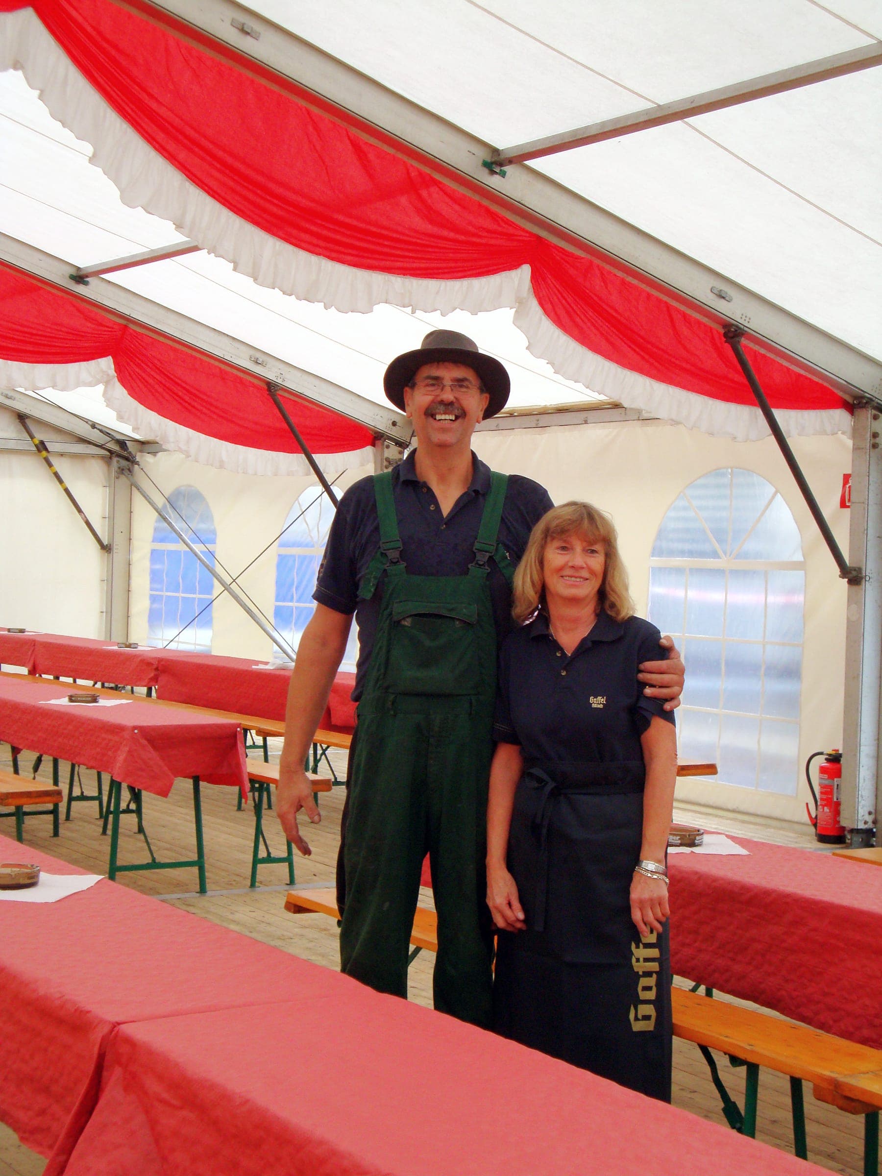 The Juchem family in an event tent laid for a celebration